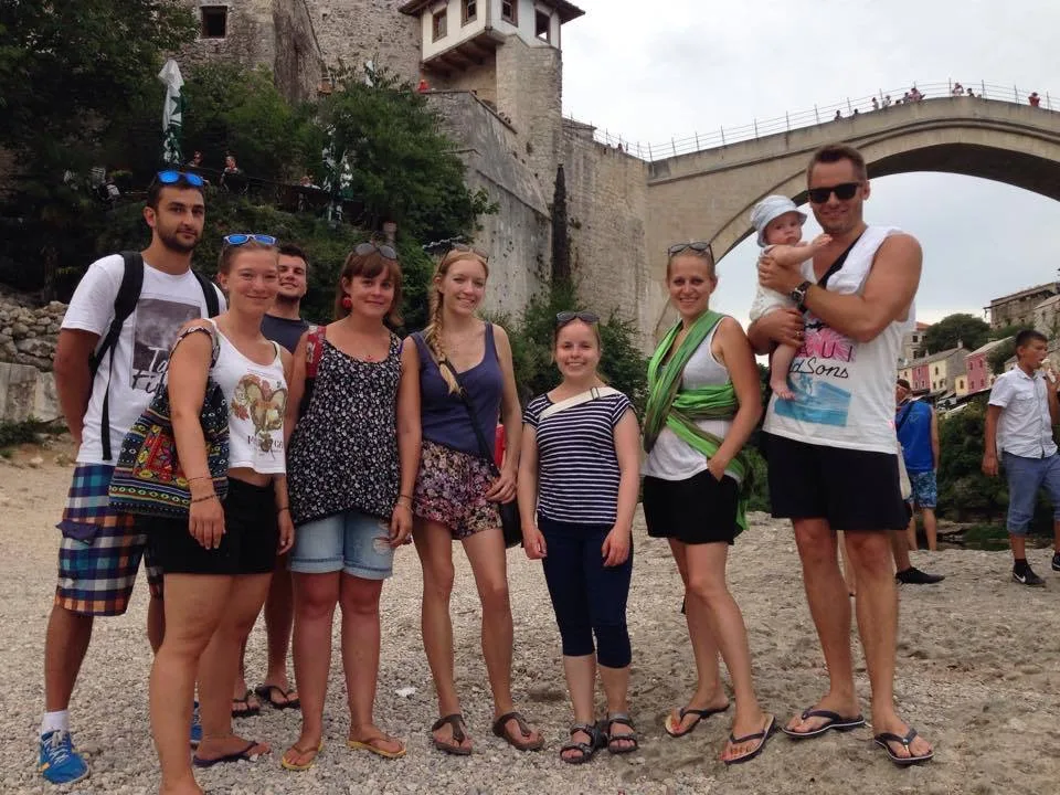 Tour group exploring Mostar's old town with local guide