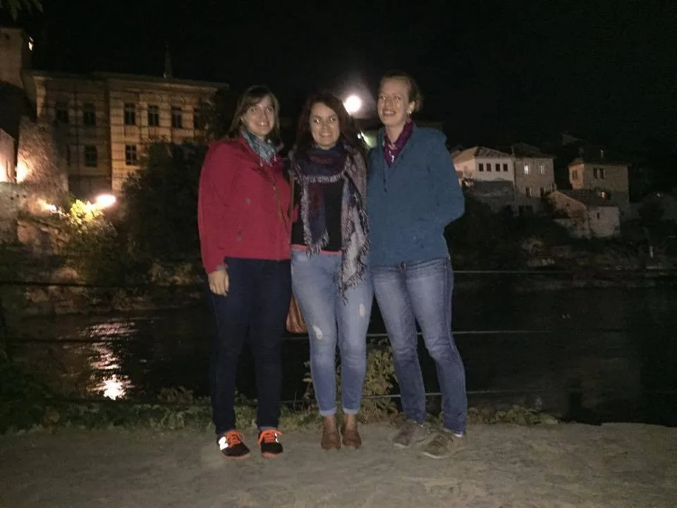 Guide explaining war history in Mostar's old town
