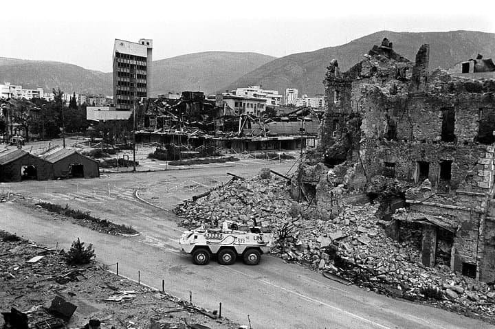Mostar war history landmarks showing rebuilt facades and memorials